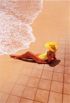 Woman on warm sand at beach and warm tile