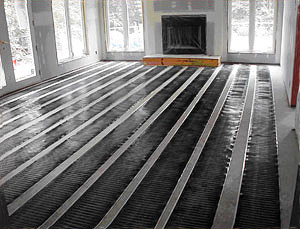 FloorHeat being installed for radiant floor heating system.